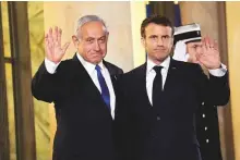  ?? AP ?? Emmanuel Macron with Benjamin Netanyahu prior to their meeting at the Elysee Palace, in Paris on Thursday.