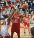  ?? GENE WALSH — MEDIANEWS GROUP ?? Upper Dublin’s Jackie Vargas goes in for a layup near Plymouth Whitemarsh’s Lainey Allen.