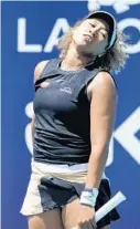  ?? LYNNE SLADKY/AP ?? Naomi Osaka reacts during her match against Maria Sakkari in the quarterfin­als of the Miami Open on Wednesday in Miami Gardens.