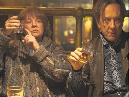  ?? Mary Cybulski Twentieth Century Fox ?? MELISSA McCARTHY, with Richard E. Grant, powerfully portrays writer Lee Israel in the film “Can You Ever Forgive Me?”