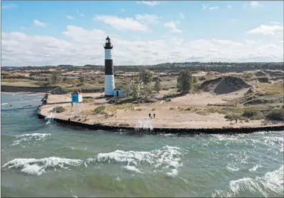  ?? ZBIGNIEW BZDAK/CHICAGO TRIBUNE ?? A new seawall protects the Big Sable Point Lighthouse at Ludington State Park on Sept. 30 in Ludington, Michigan.