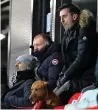  ??  ?? RUFF TIMES Owners Gary Neville, Paul Scholes and Ryan Giggs watch Salford