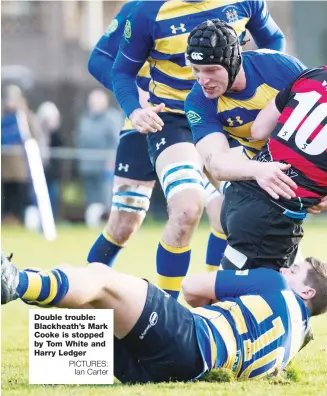  ?? PICTURES: Ian Carter ?? Double trouble: Blackheath’s Mark Cooke is stopped by Tom White and Harry Ledger