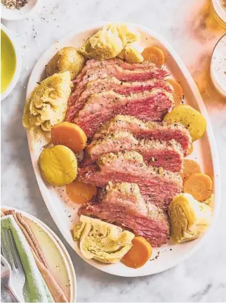  ??  ?? Corned beef and cabbage is considered an essential March recipe by many cooks. JOE LINGEMAN/THEKITCHN.COM