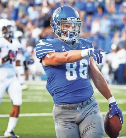  ??  ?? Memphis tight end Joey Magnifico celebrates a touchdown against the UConn defense during Saturday’s game. MARK WEBER / THE COMMERCIAL APPEAL