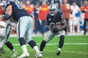  ?? Heidi Fang Las Vegas Review-journal @Heidifang ?? Josh Jacobs ran for an Nfl-best 1,653 yards and 12 touchdowns in his fourth season with the Raiders.