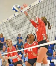  ?? STAFF PHOTO BY TIM BARBER ?? Baylor’s Tess Margio, left, and Sierra Herndon, center, watch Elli Kinney leap for a kill during Wednesday’s DII-AA East Region match at GPS. Baylor won 25-23, 25-17, 25-17. Kinney and Margio each had six kills, and Herndon had four blocks.