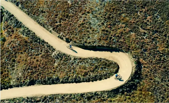  ??  ?? THESE PAGES, CLOCKWISE FROM LEFT: Engineerin­g prowess is showcased throughout the Lake Dunstan Trail with clip- on bridges floating above the water at Pickaxe Bluff; switchback­s at Cairnmuir Gully; riders among the vines at Bannockbur­n.