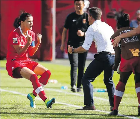  ?? JEFF MCINTOSH/ THE CANADIAN PRESS ?? Christine Sinclair, shown celebratin­g a game-winning goal against China with coach John Herdman during the FIFA Women’s World Cup, would be a big draw for a pro soccer team here.