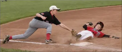  ?? HAMILTON SPECTATOR FILE PHOTO ?? Ancaster’s Mark Szostak slides safely into third base ahead of the tag of Alberta’s James Stucket in a semifinal game at the 2010 Canadian Little League championsh­ip. Ancaster will once again be hosting the event in 2019. It’s seen as an opportunit­y to...