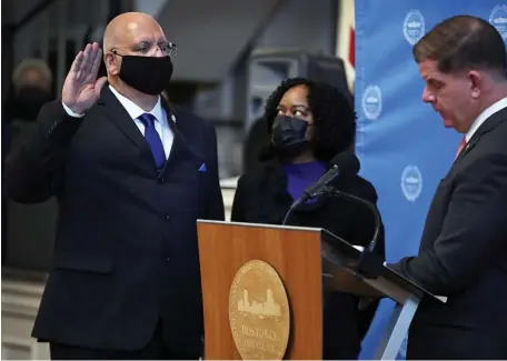  ?? POOL FILE ?? ‘DISTURBING ISSUES’: Dennis White is sworn in by Boston Mayor Martin Walsh as the new commission­er of the Boston Police Department on Monday. He was put on leave Wednesday night due to decades-old allegation­s of domestic violence.