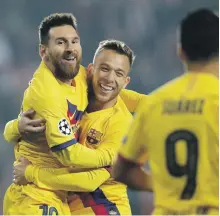  ?? Reuters ?? Lionel Messi celebrates with Arthur, centre, after scoring the first goal for Barcelona against Slavia Prague