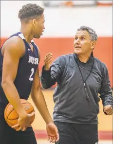  ?? Andrew Rush/Post-Gazette ?? Dukes coach Keith Dambrot talks to junior forward Eric James during practice June 22 at the A.J. Palumbo Center. Dambrot comes from Akron, where he was the Mid-American Conference coach of the year each of the past two years.