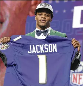  ?? MAX FAULKNER / FORT WORTH STAR-TELEGRAM ?? The Ravens selected quarterbac­k Lamar Jackson with the 32nd overall draft pick just a few weeks after signing Robert Griffin III.