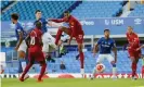  ?? Photograph: Tom Jenkins/NMC pool ?? Liverpool’s Joël Matip sends a header wide. He later went off injured