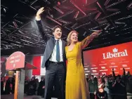  ?? SEAN KILPATRICK THE CANADIAN PRESS FILE PHOTO ?? Justin Trudeau and wife Sophie Grégoire Trudeau celebrate at Liberal election headquarte­rs in Montreal in 2019.