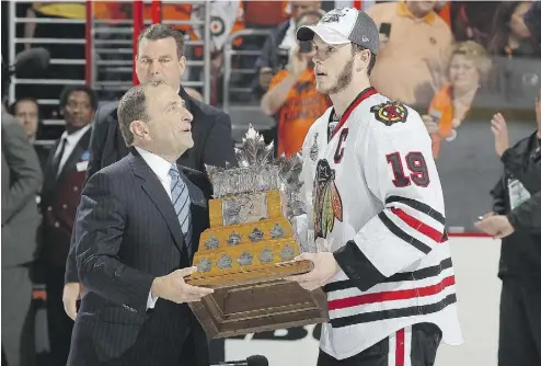  ?? GETTY IMAGES FILES ?? NHL Commission­er Gary Bettman says there are “countless examples” of teams that bottomed out before rebuilding as championsh­ip- calibre teams, such as the Chicago Blackhawks, who have captured three Stanley Cups since 2010.
