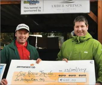  ??  ?? Amber Park manager Paul Gorby from The Amber Springs hotel presents €600 to sponsor one of the twelve kennels at the Seal Rescue Ireland centre in Courtown. He is pictured with centre manager Ivan Kelly.