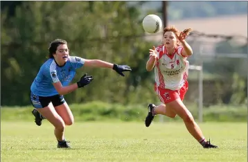  ??  ?? Tinahely’s Aimee Maher wins the race for possession against Kate Shannon of Longford Slashers.