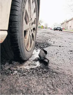  ??  ?? A large pothole in Finella Gardens, Dundee. Above right: Mark Flynn, depute convener of city developmen­t.