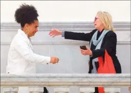  ?? Mark Makela ?? The Associated Press Bill Cosby accusers Lili Bernard, left, and Victoria Valentino reach out to embrace outside the Norristown, Pa., courtroom Thursday after Cosby was found guilty.