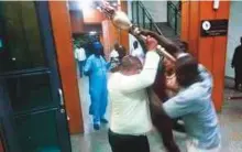  ?? AFP ?? ■ People trying to take possession of the mace at the Upper Legislativ­e Chamber in Abuja on Wednesday.