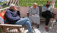  ?? — AFP photos ?? Palestinia­n men from the Gaza Strip sit on benches in a small hotel near the Augusta Victoria Hospital in east Jerusalem, where they received treatment for cancer.