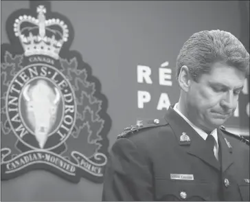  ?? Darryl Dyck/the Canadian Press ?? RCMP Deputy Commission­er Craig Callens, the commanding officer of the RCMP in British Columbia, reads a brief statement in response to Commission­er Wally Oppal’s inquiry report.