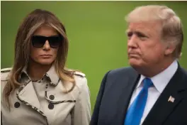  ?? Photo: Drew Angerer/Getty ?? Donald Trump with what some people are saying was a body double for wife Melania on the south lawn of the White House.