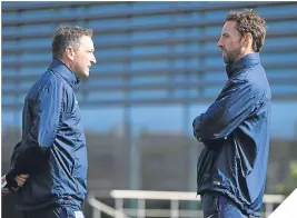  ??  ?? Gareth Southgate, right, and assistant Steve Holland.