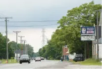  ?? MICHAEL GARD/POST-TRIBUNE ?? A view looking west down State Road 130 in Wheeler on July 8. A proposed road extension of Willowcree­k Road would pass through the town with a bridge to be built over the road.