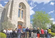  ?? Adam Carey ?? People gather outside St. Mary’s Catholic Church on Thursday as the church receives its historic landmark designatio­n from the city of Rome.