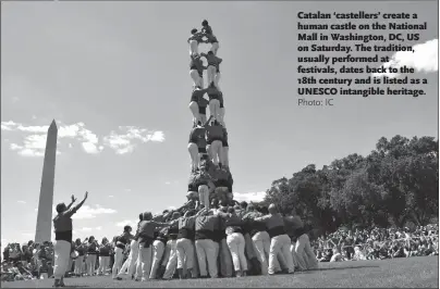  ?? Photo: IC ?? Catalan ‘castellers’ create a human castle on the National Mall in Washington, DC, US on Saturday. The tradition, usually performed at festivals, dates back to the 18th century and is listed as a UNESCO intangible heritage.