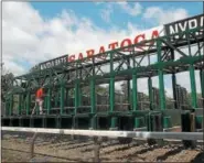  ?? PHOTO PROVIDED BY SPENCER TULIS ?? Mark Chavez gets the starting gate ready before the first race of the day on July 21at Saratoga Race Course.