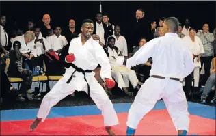  ?? Picture: SUPPLIED ?? RED-HOT GLOVES: Lutho Singata in action on his way to winning the men’s Kumite division during the Secko Karate Championsh­ips held at the Fish River Sun Resort over the weekend