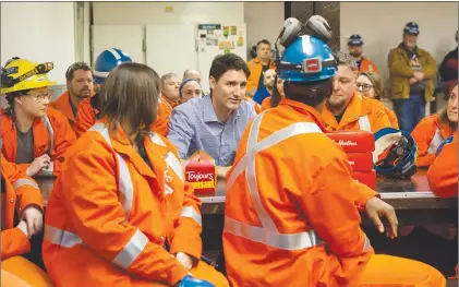  ?? CP PHOTO ?? Prime Minister Justin Trudeau speaks with workers during a visit to Stelco Hamilton Works in Hamilton Ont., Tuesday.