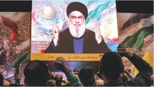  ?? (Anwar Amro/AFP via Getty Images) ?? HEZBOLLAH SECRETARY-GENERAL Hassan Nasrallah delivers a televised speech during a gathering to mark annual Quds (Jerusalem) Day commemorat­ions in Beirut’s southern Dahiya suburb on April 5.