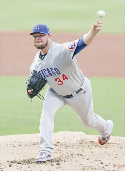  ?? RON SCHWANE/GETTY IMAGES ?? Starter Jon Lester picked up his second victory after going six innings and allowing one run and three hits.