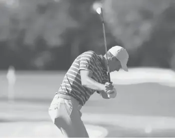  ?? EHRMANN/GETTY MIKE ?? Jordan Spieth hits during a practice round before the Masters on Monday at Augusta National Golf Club in Augusta, Ga.