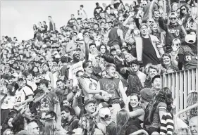  ?? CATHIE COWARD HAMILTON SPECTATOR FILE PHOTO ?? Barring any setbacks, there will be beer at McMaster’s Homecoming Game in September. In 2015, when this photo was taken, students weren’t allowed to consume suds in the stands.