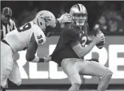  ?? ASSOCIATED PRESS ?? WASHINGTON QUARTERBAC­K Jake Browning (right) is sacked by Arizona State linebacker Malik Lawal (39) during the first half of Saturday’s game in Seattle.