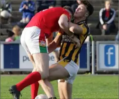  ??  ?? Eoghan Nolan clashes with county colleague Nick Doyle during the 2-16 to 0-12 semi-final victory against Starlights.