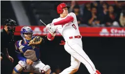  ?? (Reuters) ?? LOS ANGELES ANGELS designated hitter Shohei Ohtani hit a tie-breaking homer in the eighth inning, sending the Angels to a 3-2 home victory and a three-game sweep of the Texas Rangers on Wednesday night.