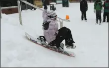  ??  ?? Thrill-seekers had a ball as they made the most of the wintry conditions in Kelvingrov­e Park and on the Royal Concert Hall steps