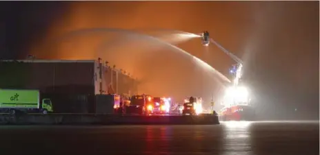  ?? PASCAL MARCHAND ?? The William Lyon Mackenzie fire boat used water from Lake Ontario to help put out the flames in the Port Lands Thursday.