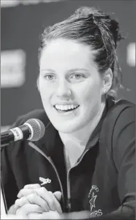  ?? By Mark Humphrey, AP ?? College try: Missy Franklin, 17, speaking at a news conference in Omaha on Sunday, plans to go to college rather than turn pro.