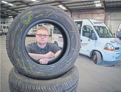  ?? Picture: Kenny Smith. ?? Maintenanc­e administra­tor Paul Richards with some of the damaged tyres.