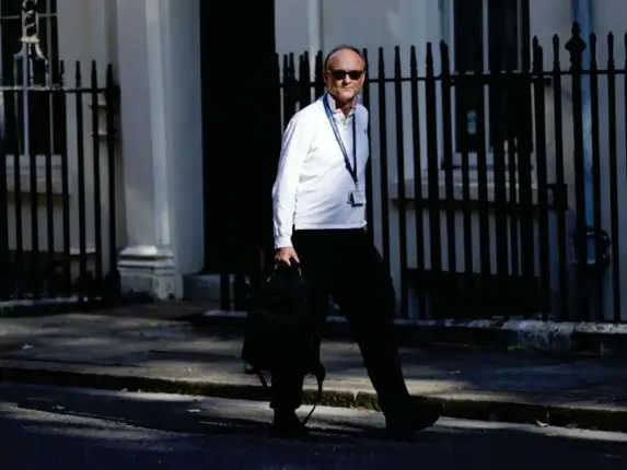  ?? (Reuters) ?? The special adviser arriving for a cabinet meeting on 21 July, the first since mid-March due to the pandemic