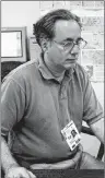  ?? AP PHOTO/CHUCK ZOELLER ?? In this July 28, 1996 photo, Associated Press senior photo editor Michael Feldman works at the Summer Olympics in Atlanta. The veteran wire service photograph­er and editor has died. He was 70.