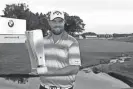  ?? BRIAN SPURLOCK/USA TODAY SPORTS ?? Marc Leishman poses with the trophy after winning the BMW Championsh­ip on Sunday. He shot a 4-under 67 for a five-stroke victory.